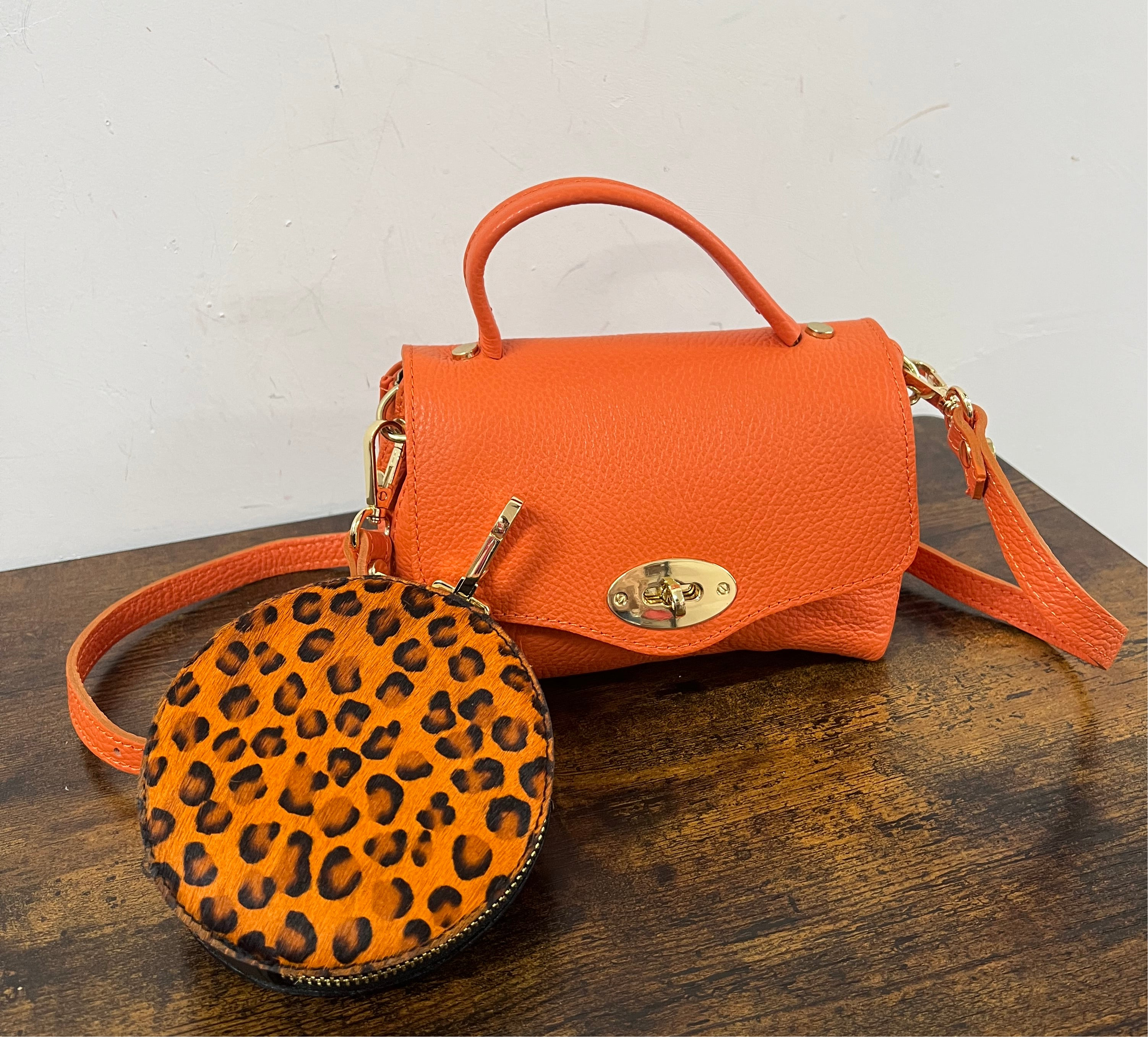 Country pocket arancio e rotondo zip cavallino