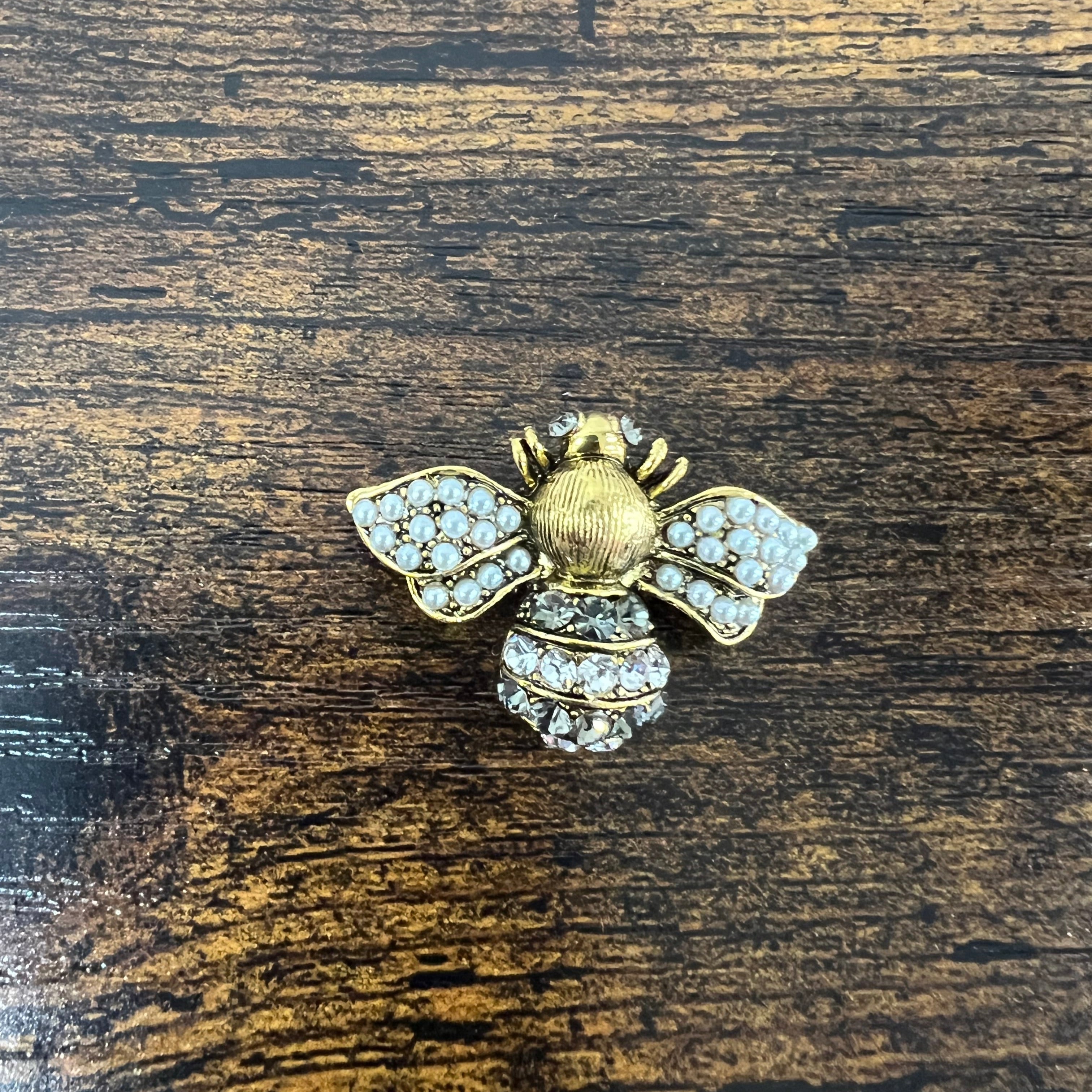 Spilla apina base dorata strass bianco