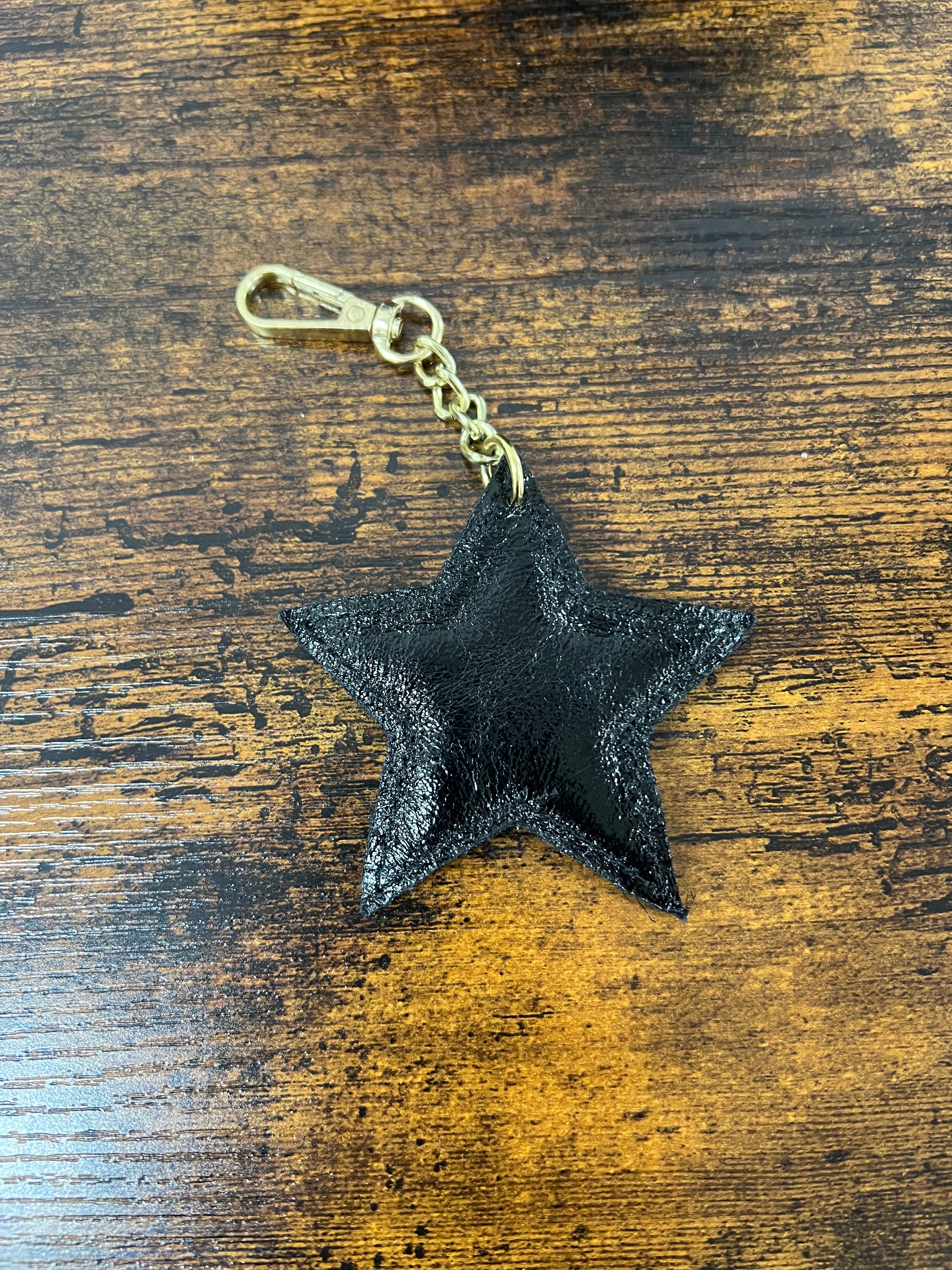 Stella in vera pelle nero laminato