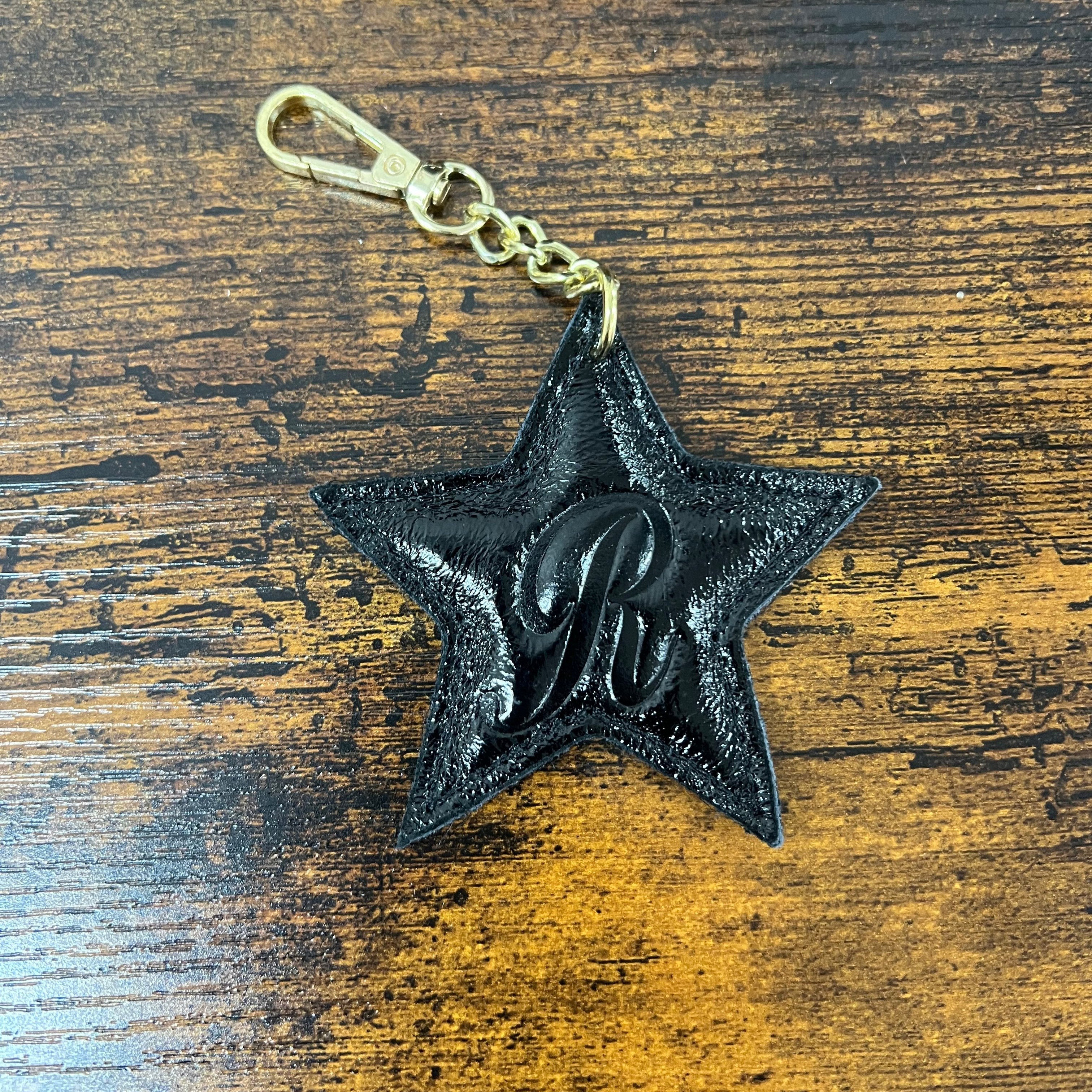 Stella in vera pelle nero laminato