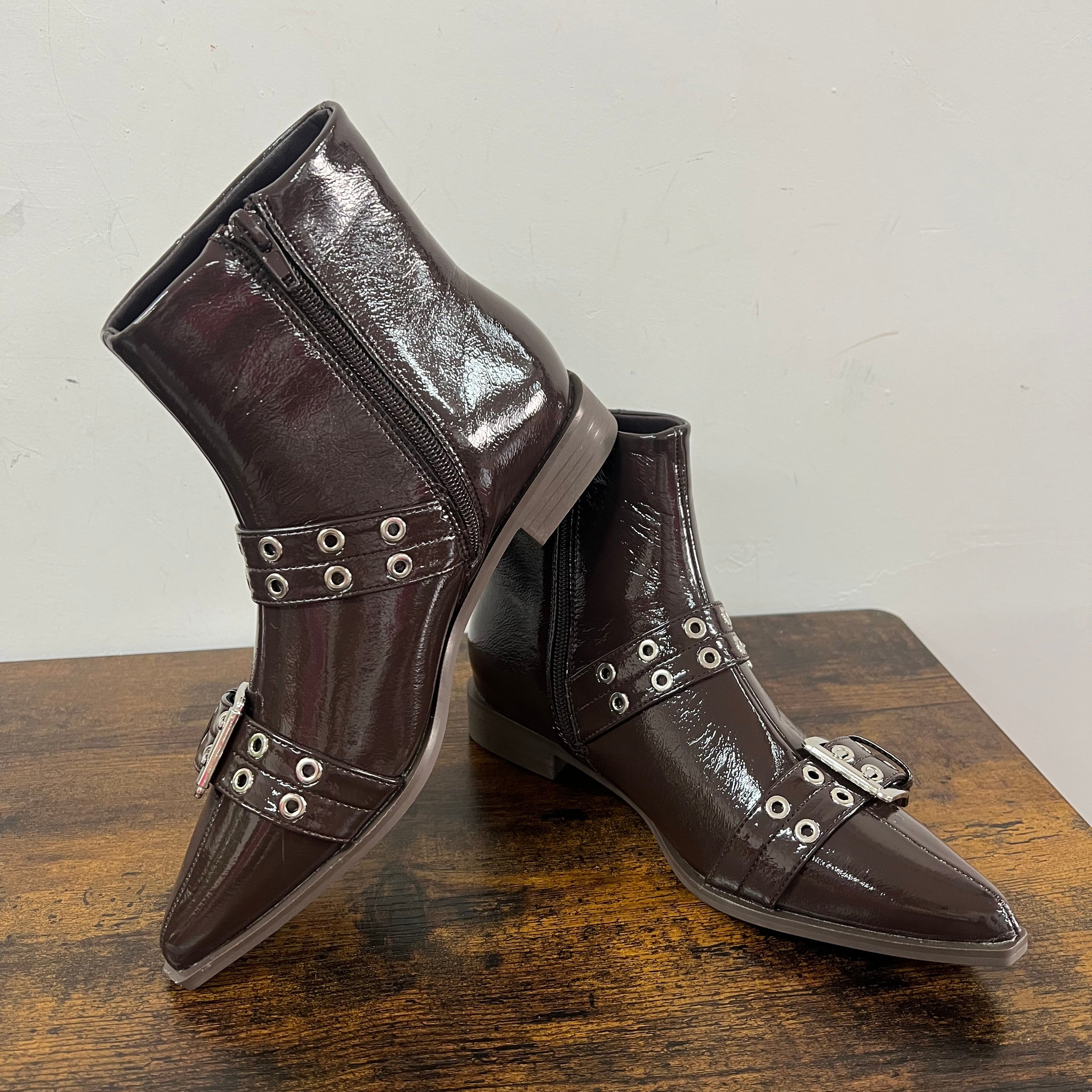 Brown patent leather ankle boots with buckles