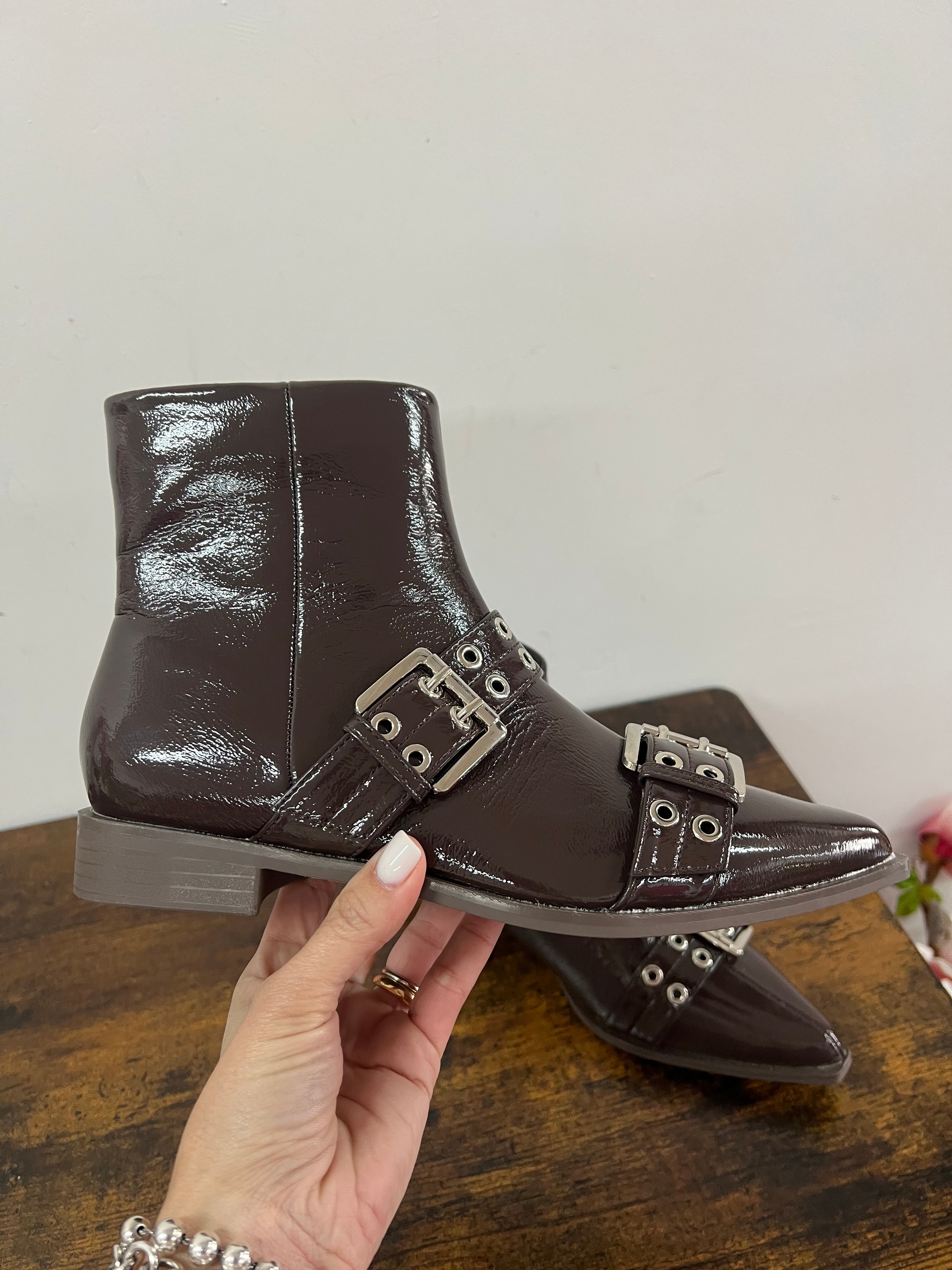 Brown patent leather ankle boots with buckles