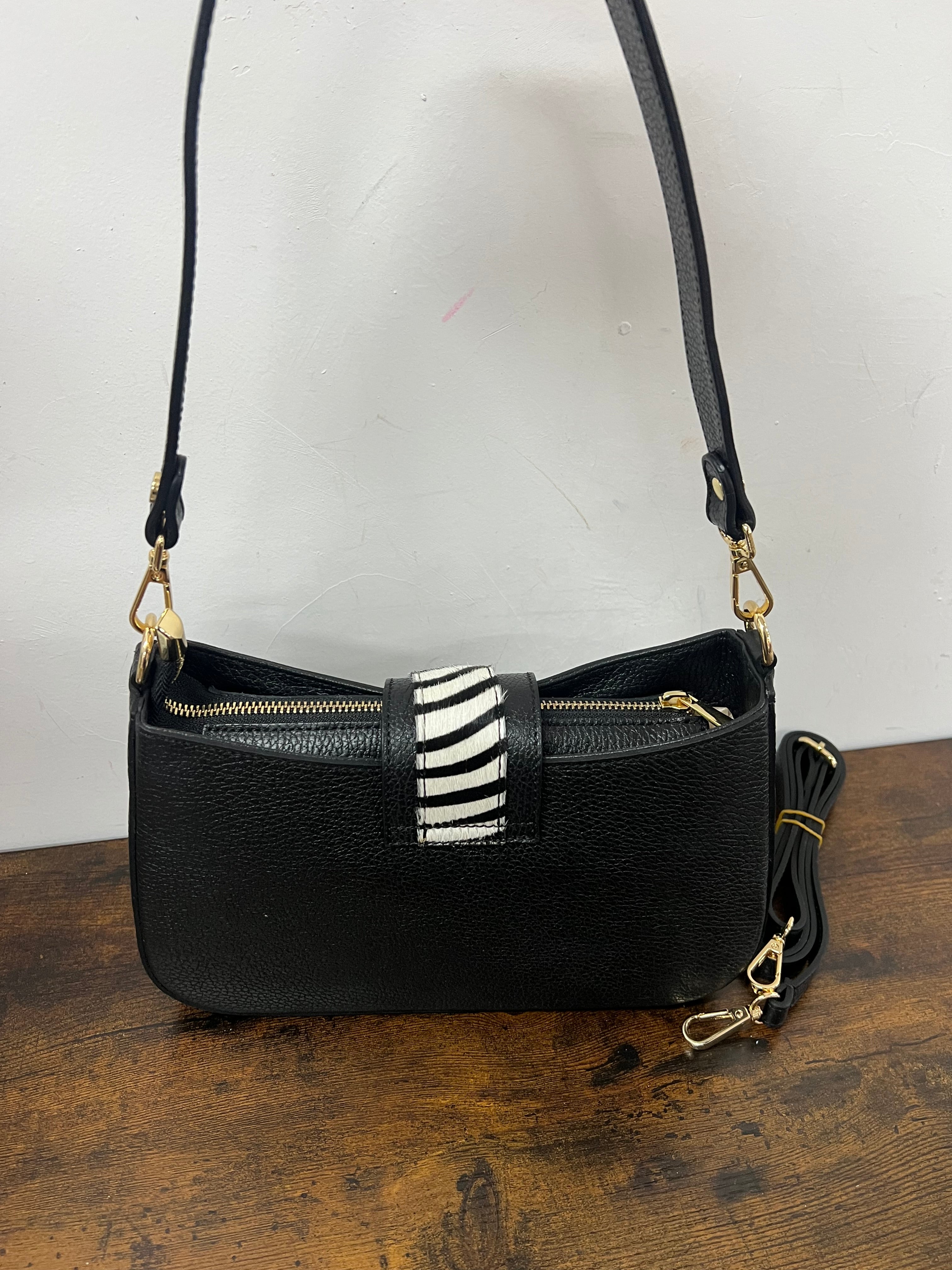 White and black zebra print horse-shaped baguette bag