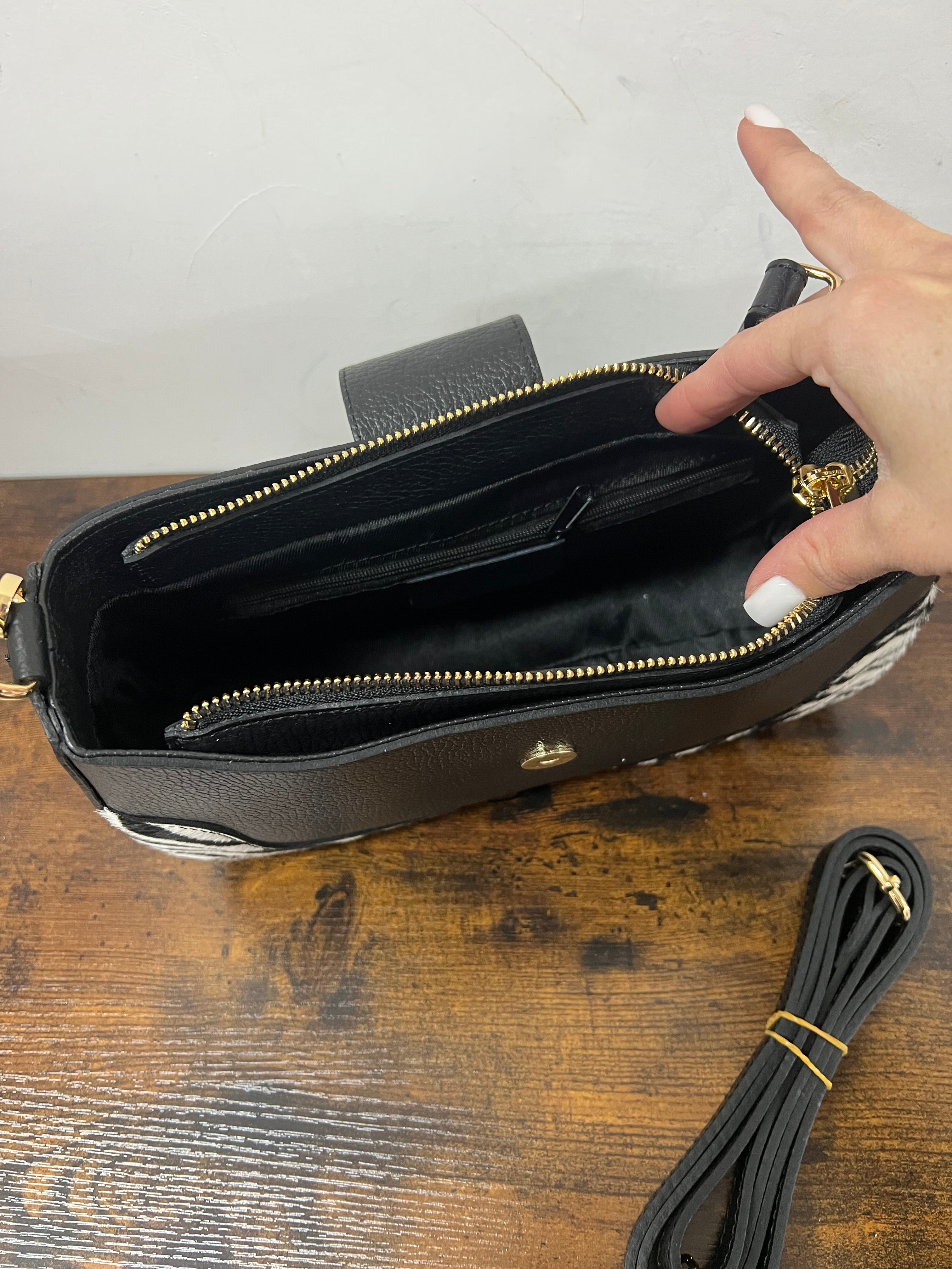 White and black zebra print horse-shaped baguette bag