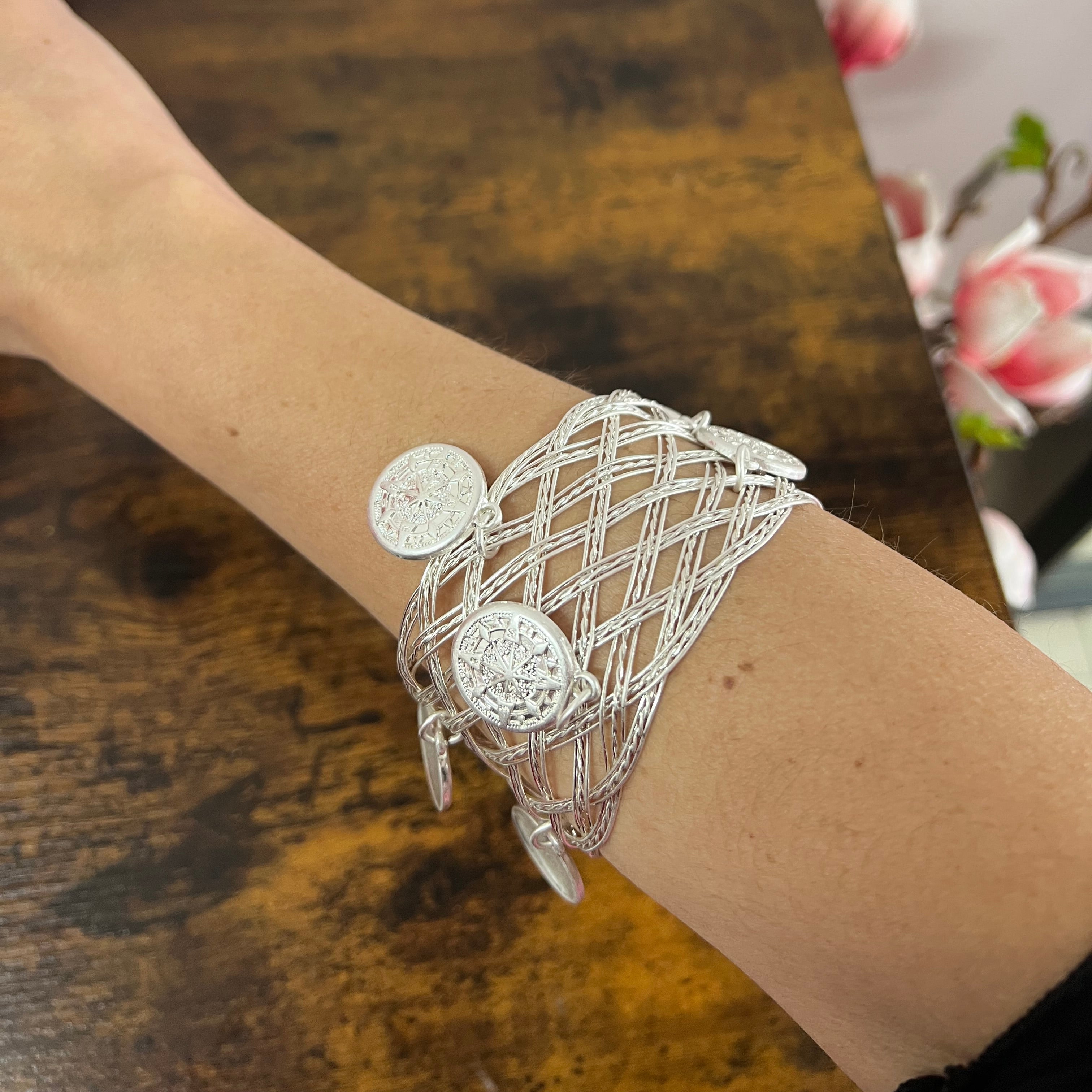 Rigid silver-plated coin bracelet