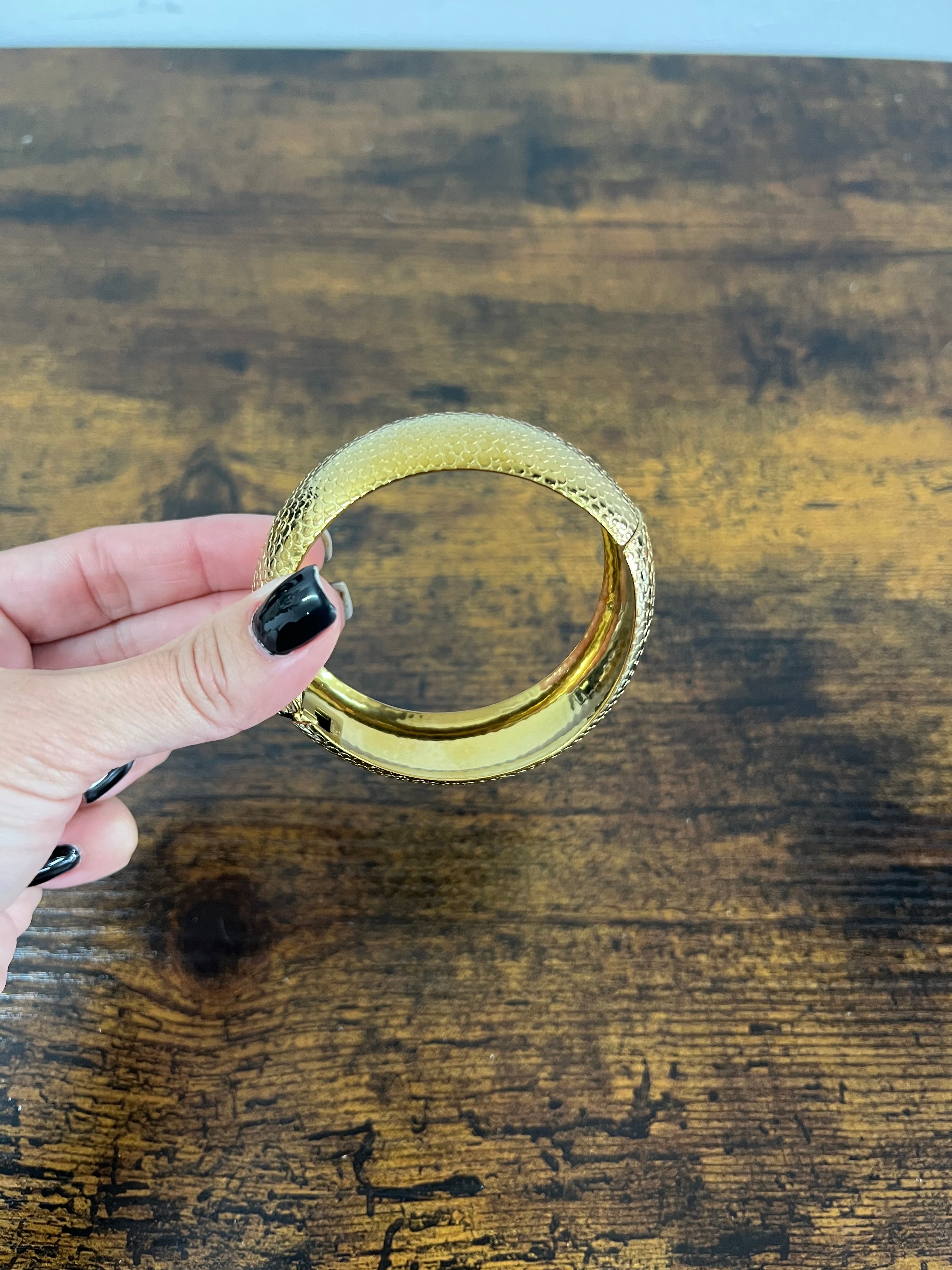 Rigid gilded satin python bracelet