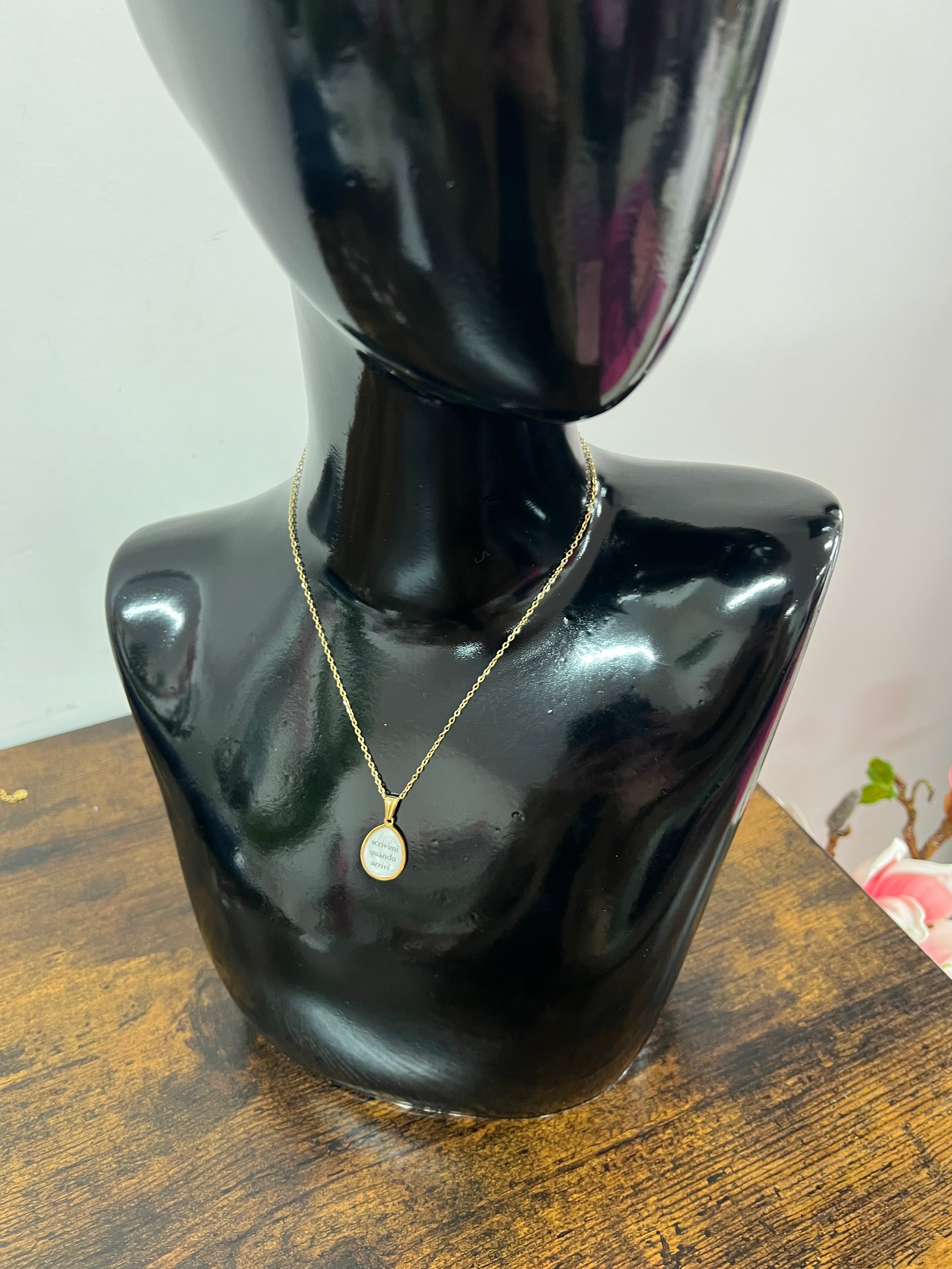 Necklace with a small medal write to me when you arrive