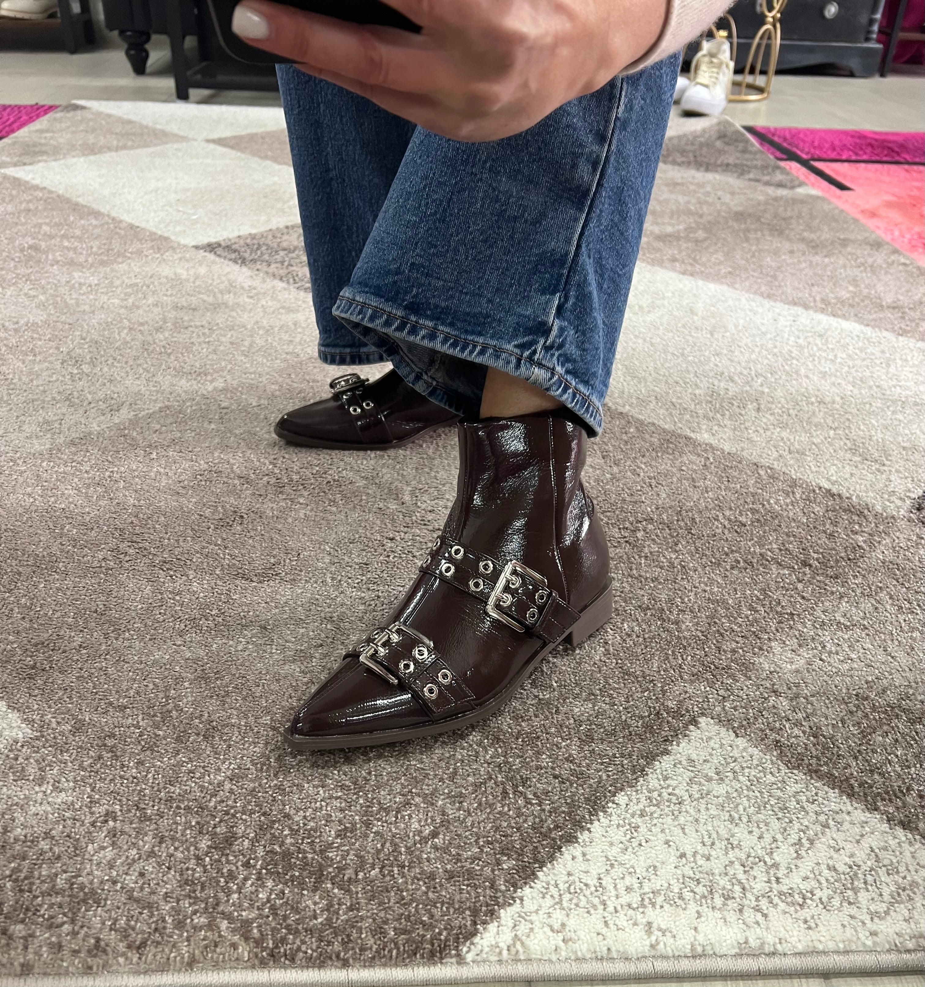 Brown patent leather ankle boots with buckles