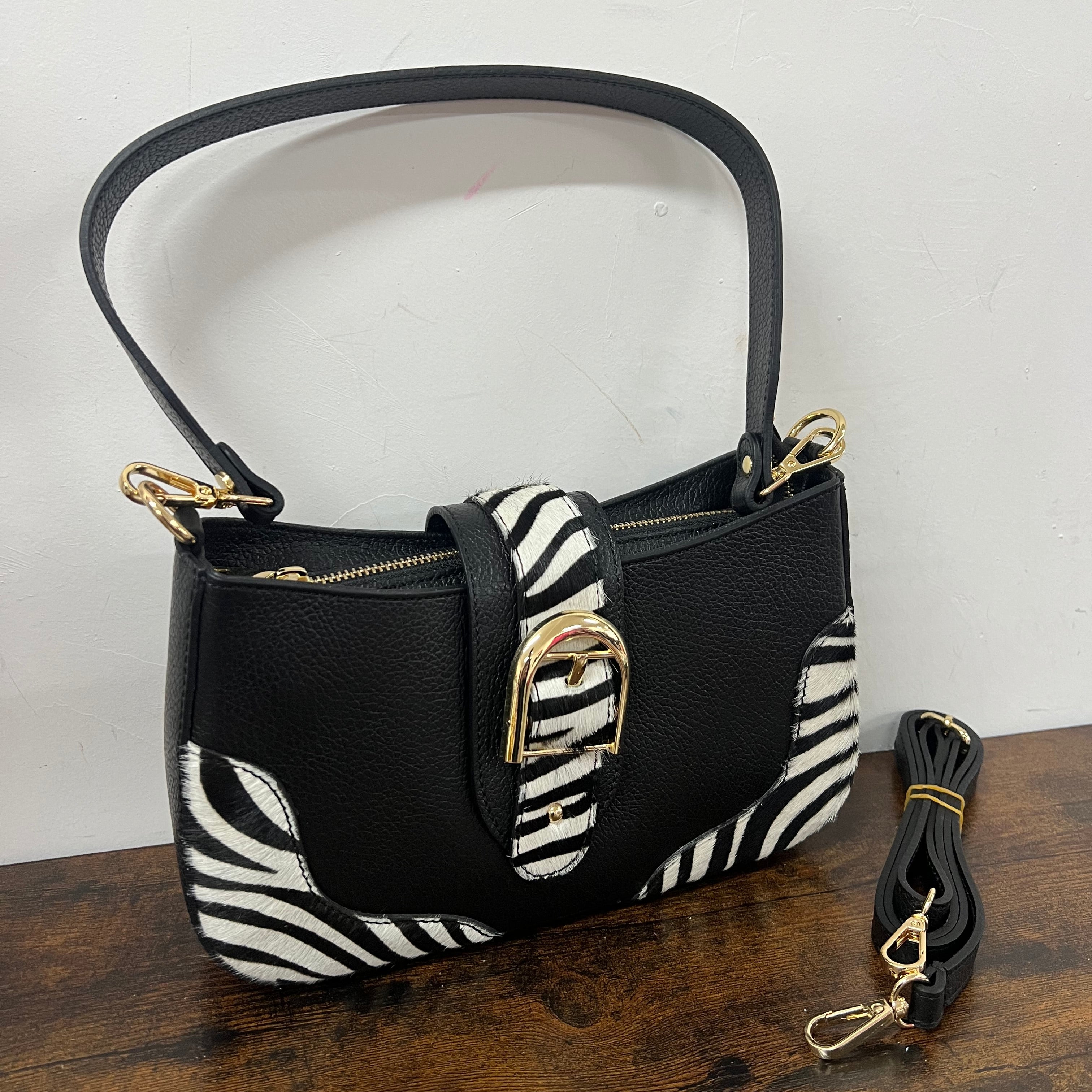 White and black zebra print horse-shaped baguette bag