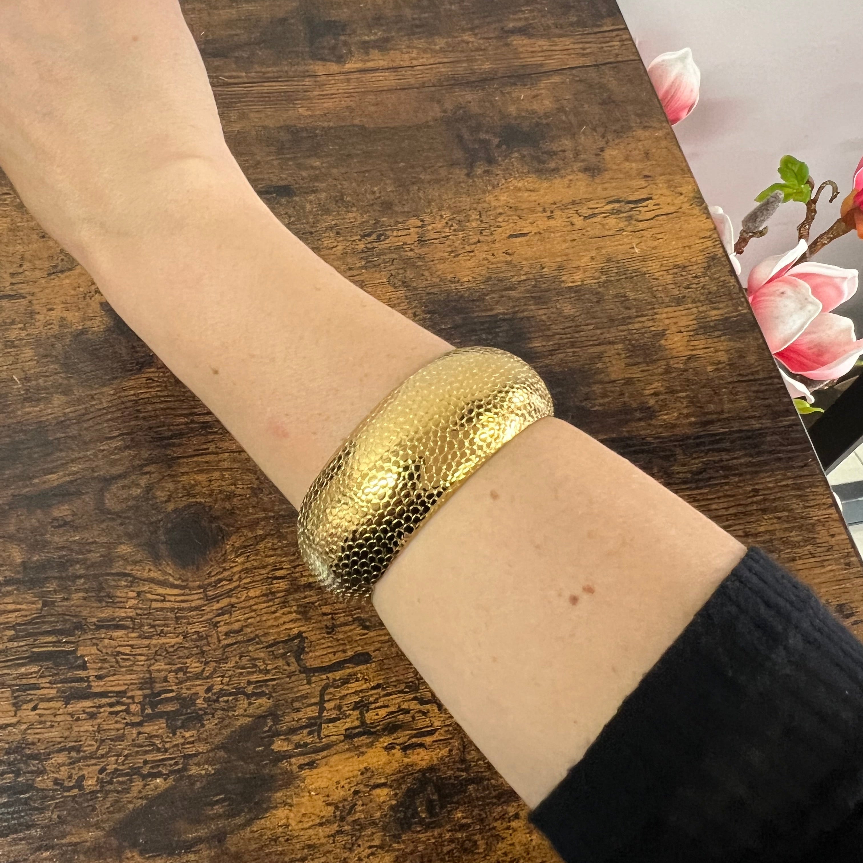 Rigid gilded satin python bracelet