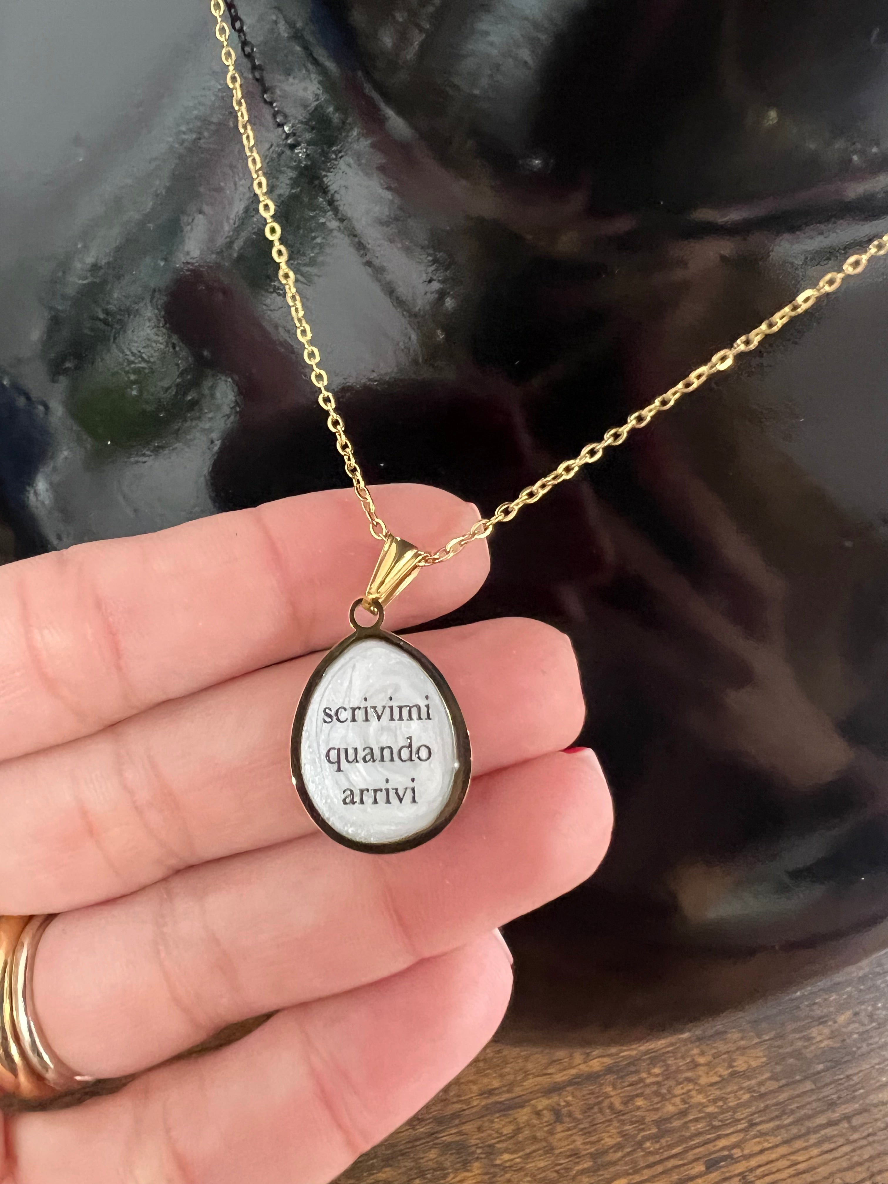 Necklace with a small medal write to me when you arrive