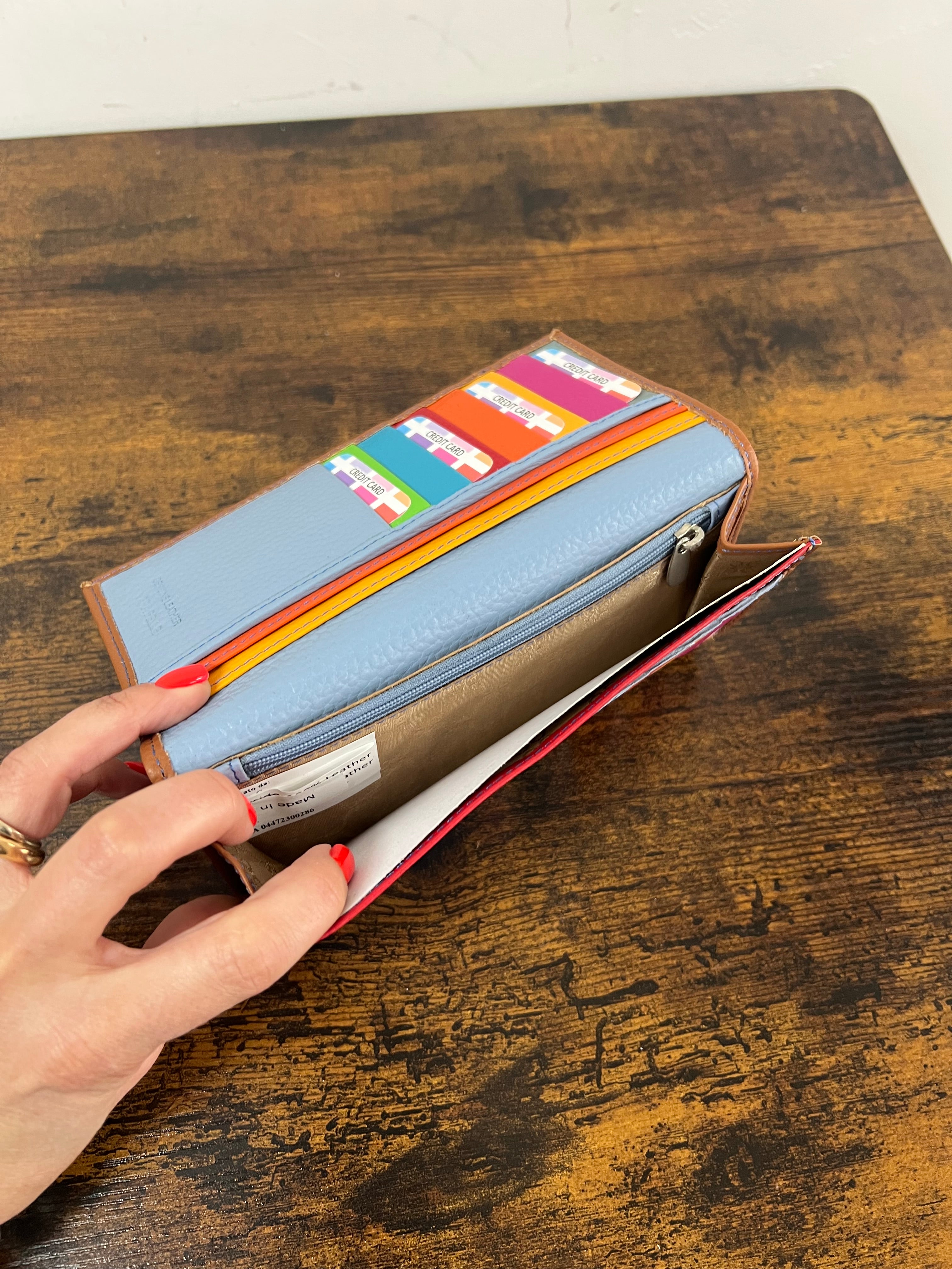 Big open dark leather card holder